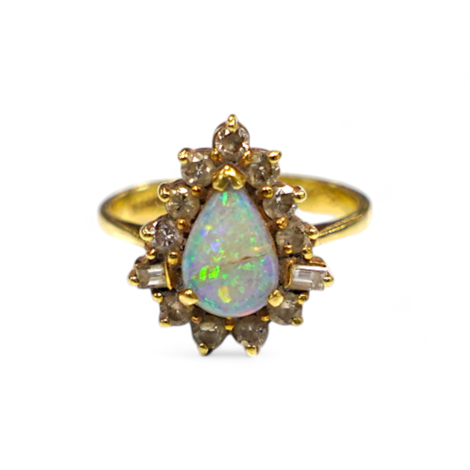 An 18k, white opal and round and baguette cut diamond set pear shaped cluster ring, size K/L, gross weight 4.6 grams. Condition - poor